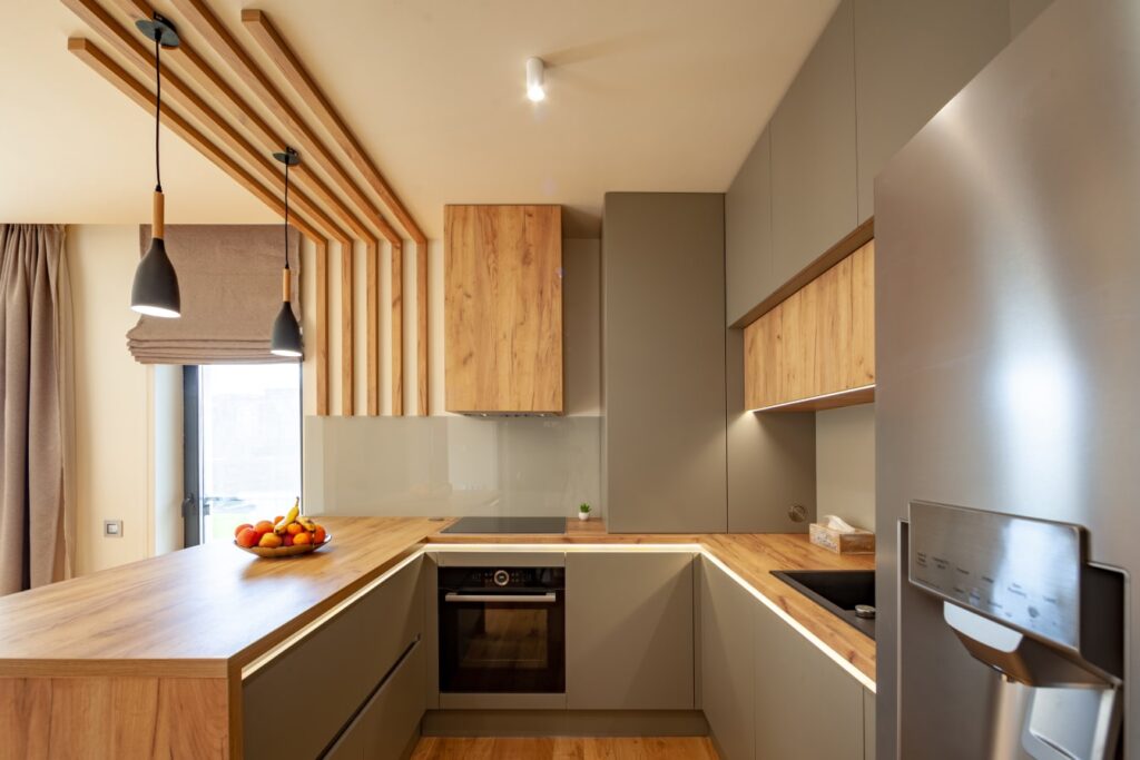 Image of a newly remodeled kitchen with modern appliances, spacious countertops, and elegant cabinetry.